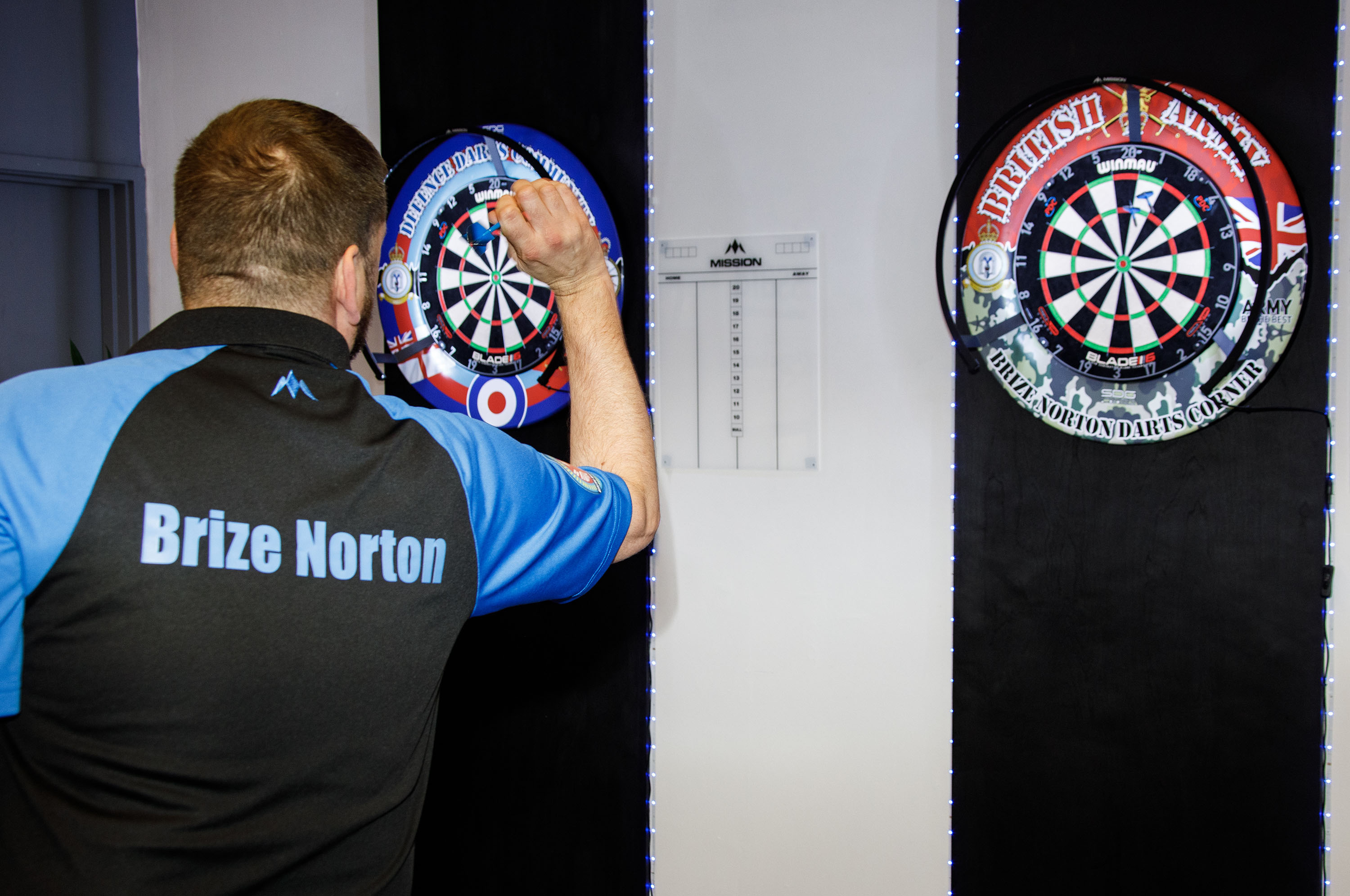 Photo - RAF Brize Norton Darts Team member throwing a dart at dartboard